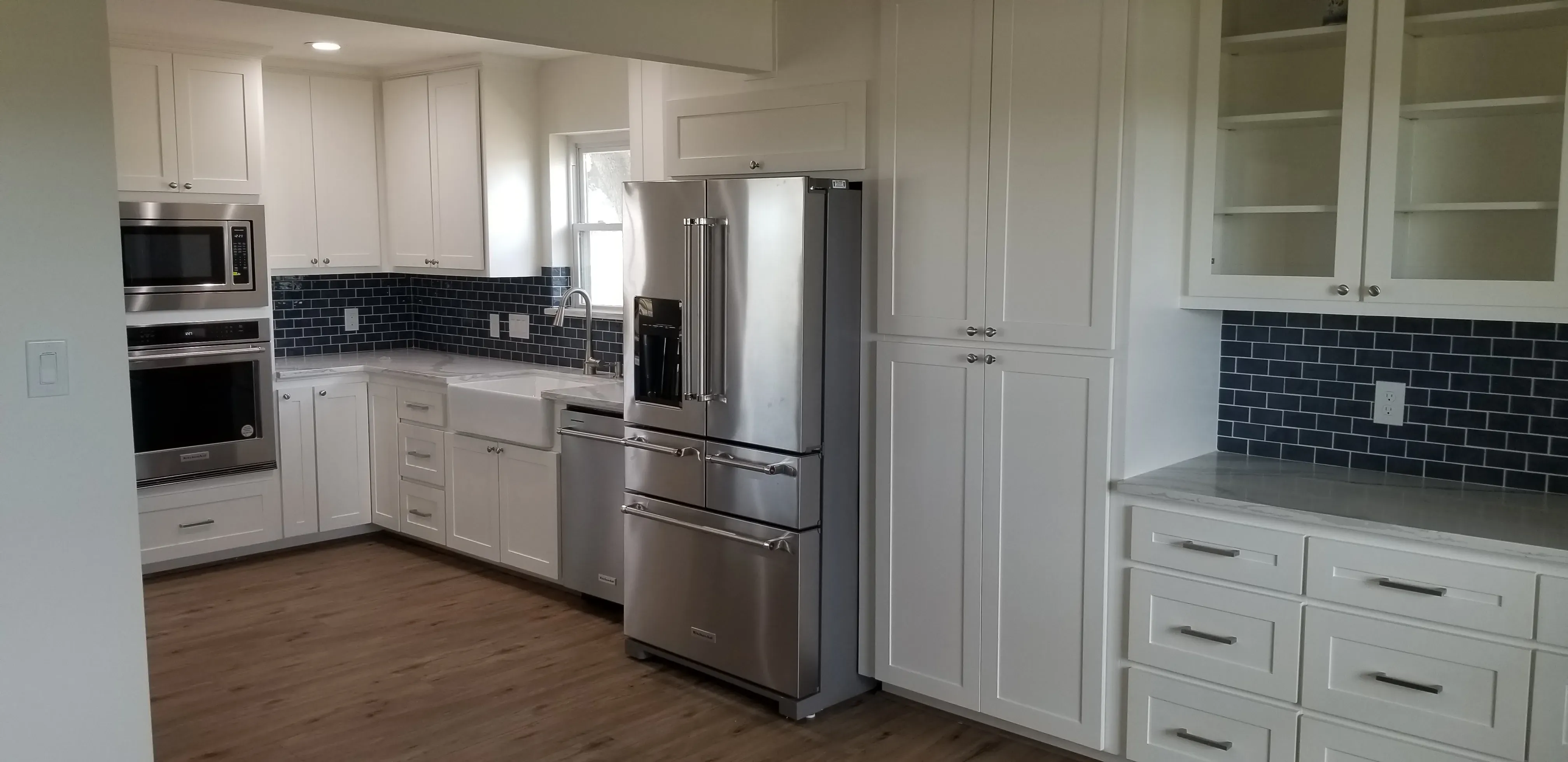 Custom kitchen cabinets with integrated appliance garage and roll-up door