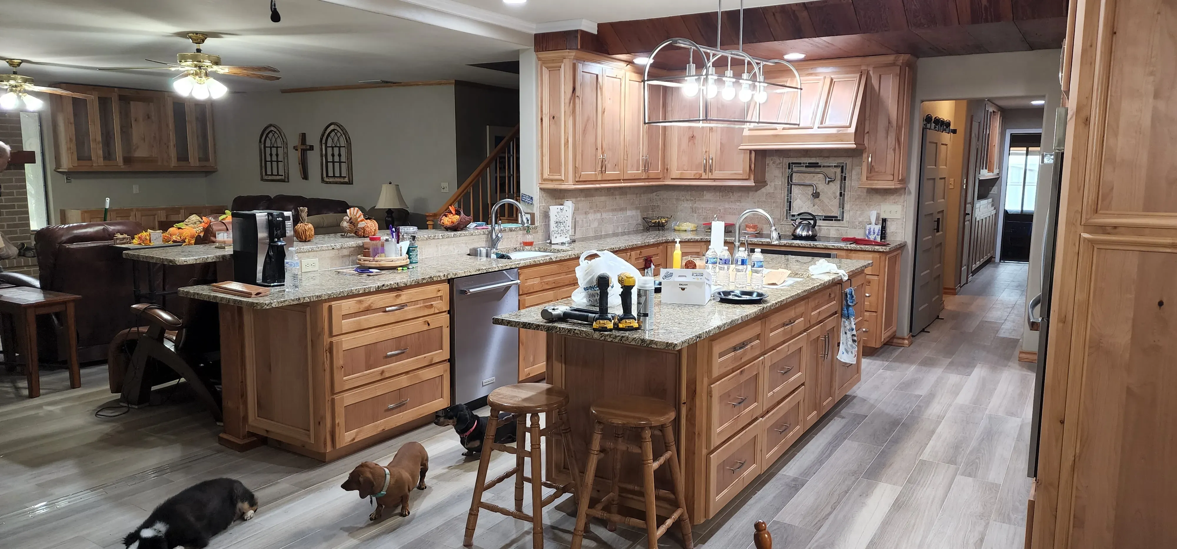 Handcrafted cherry wood upper cabinets with crown molding detail