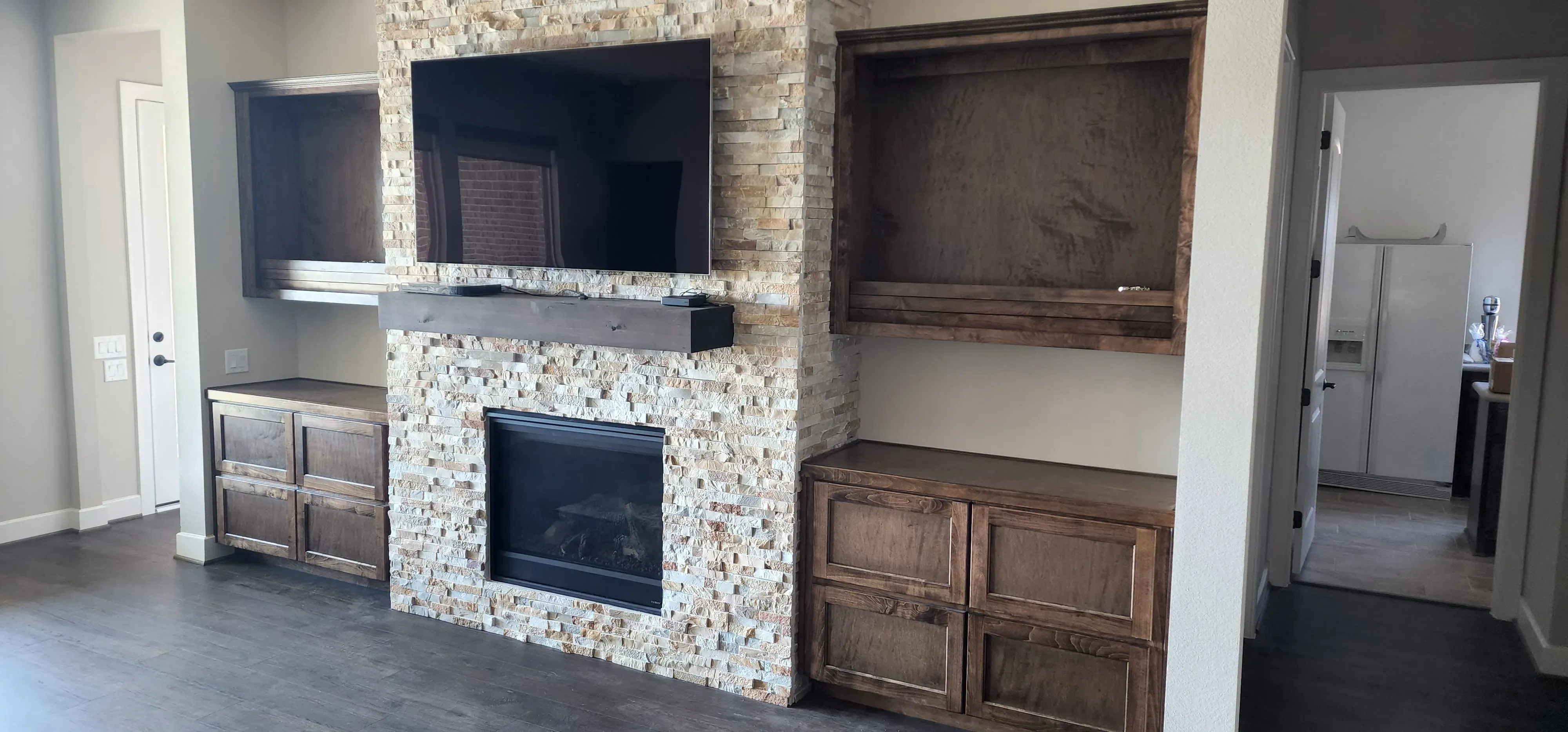 Custom craft room built-in with pegboard backing, pull-out bins, and countertop workspace