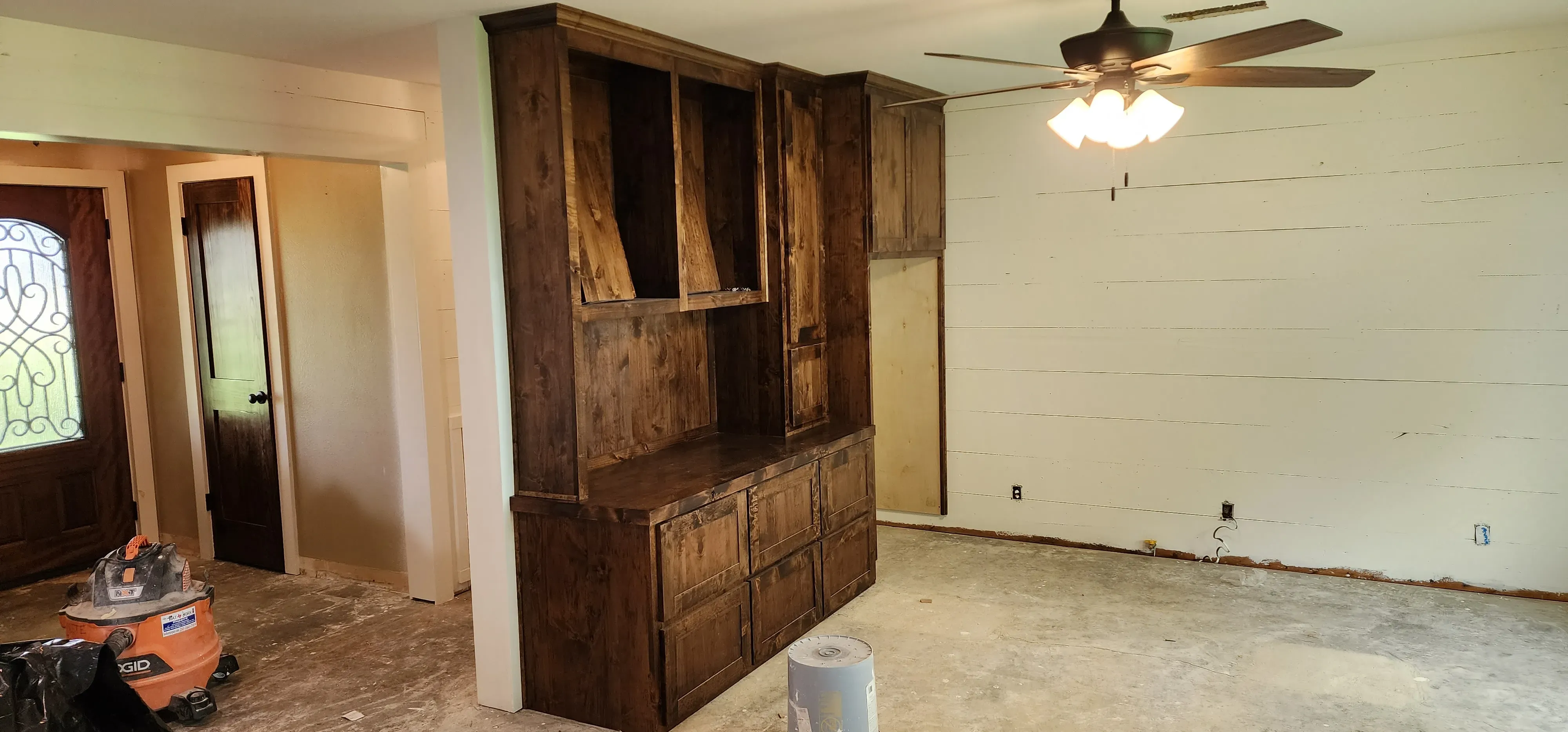 Living room built-in shelving unit with mixed open and closed storage compartments