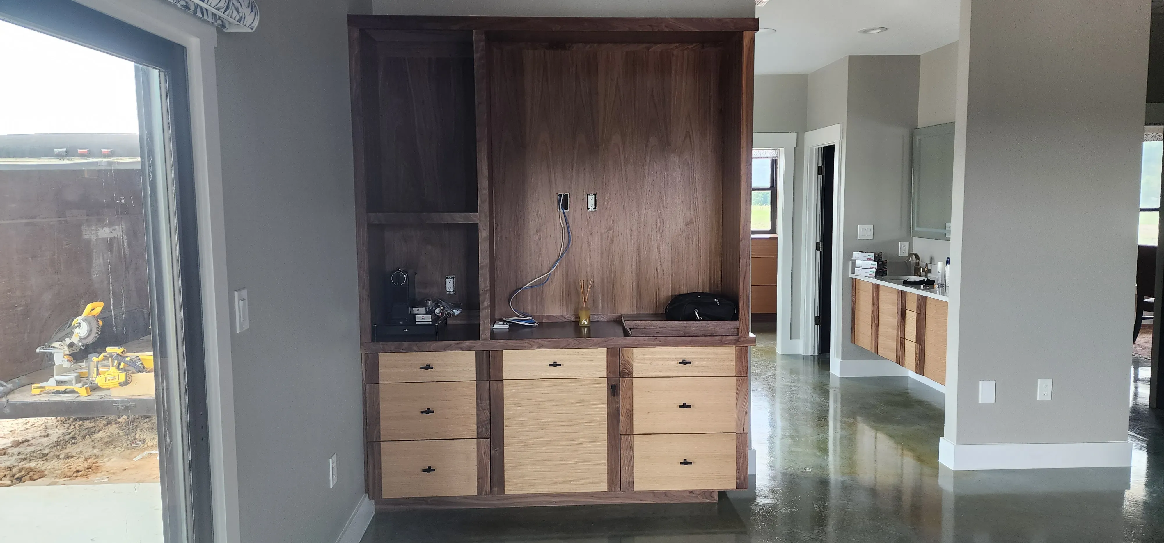 Custom built-in bench and cubby unit for a home entryway with shiplap backing