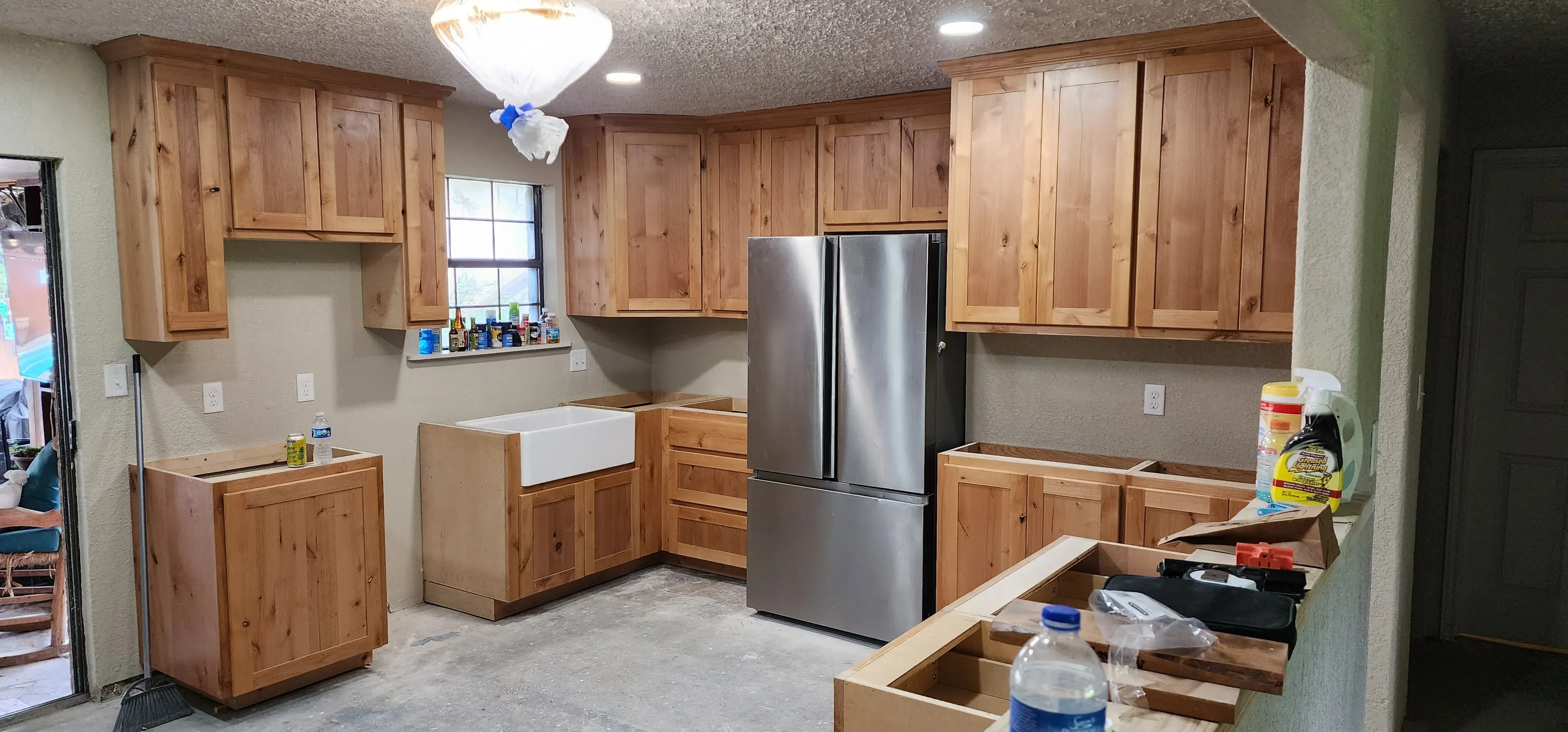 Walnut kitchen island with granite countertop and under-cabinet lighting