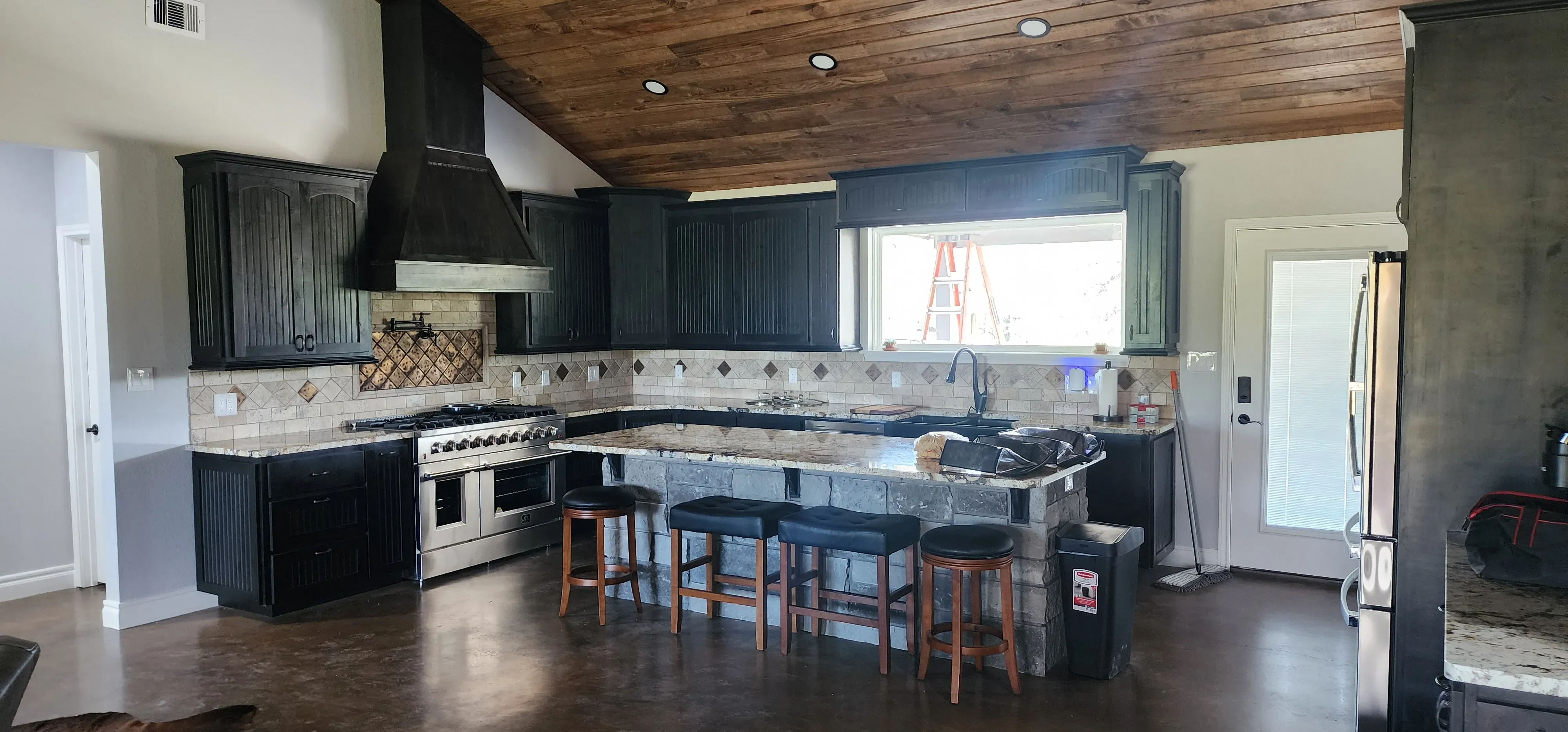 Kitchen island with butcher block top and integrated wine rack storage