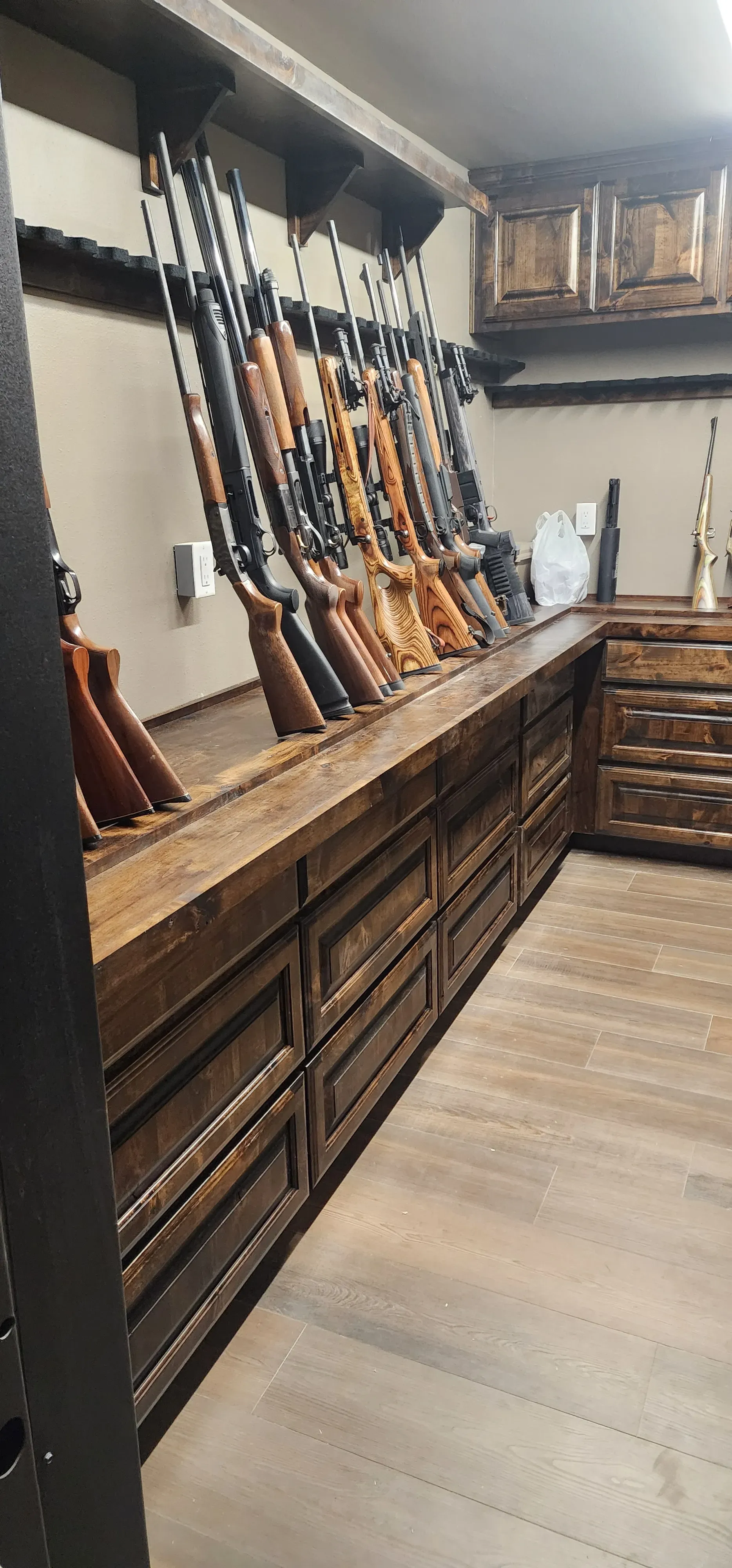 Bedroom built-in headboard wall with floating nightstands and reading light recesses