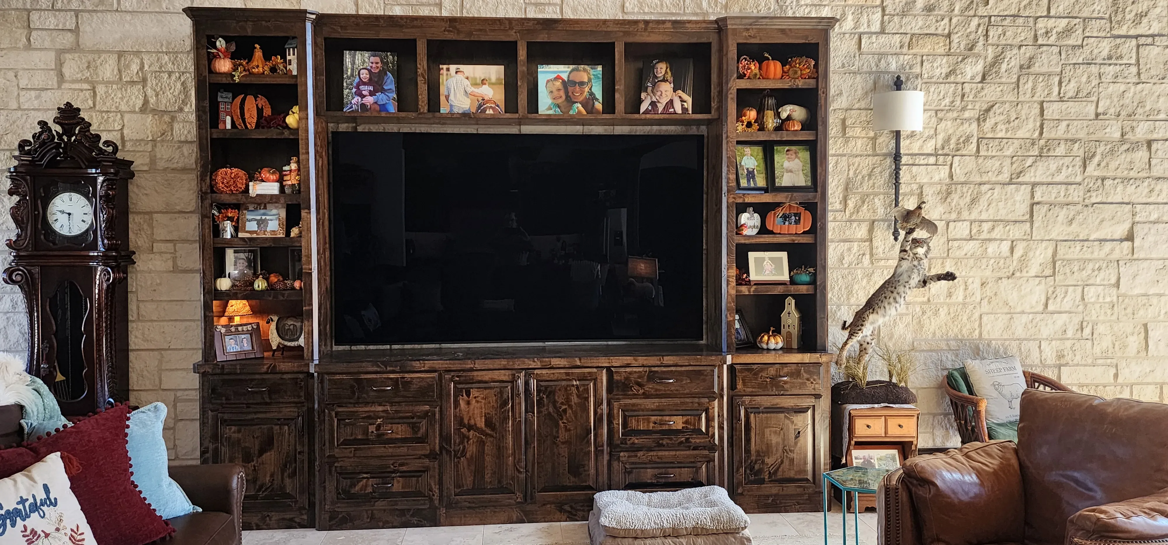 Built-in media console with floating shelves and recessed panel doors