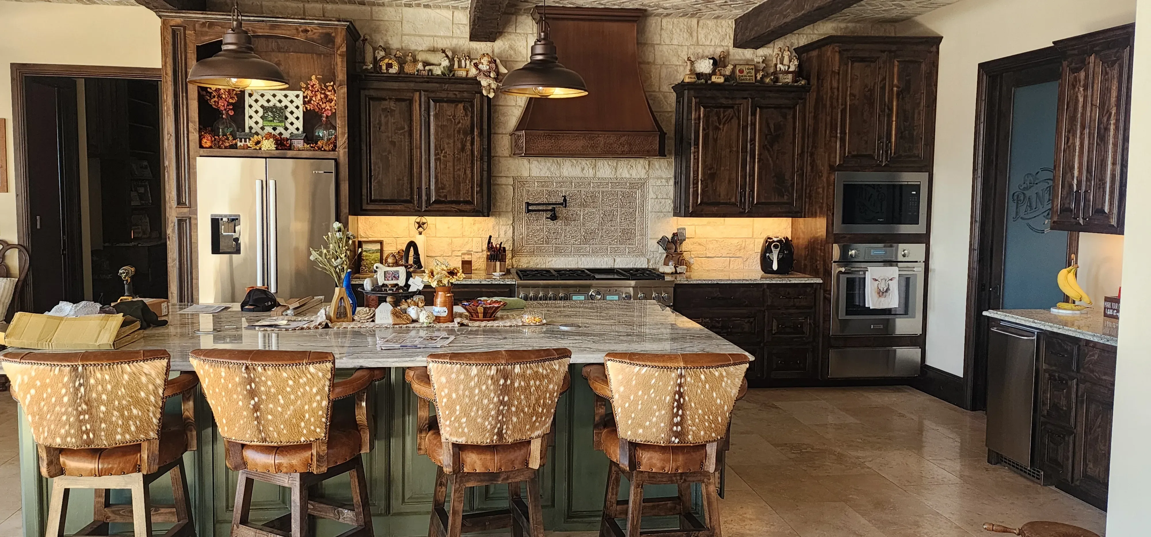 Galley kitchen renovation with white painted cabinets and brass cup pulls