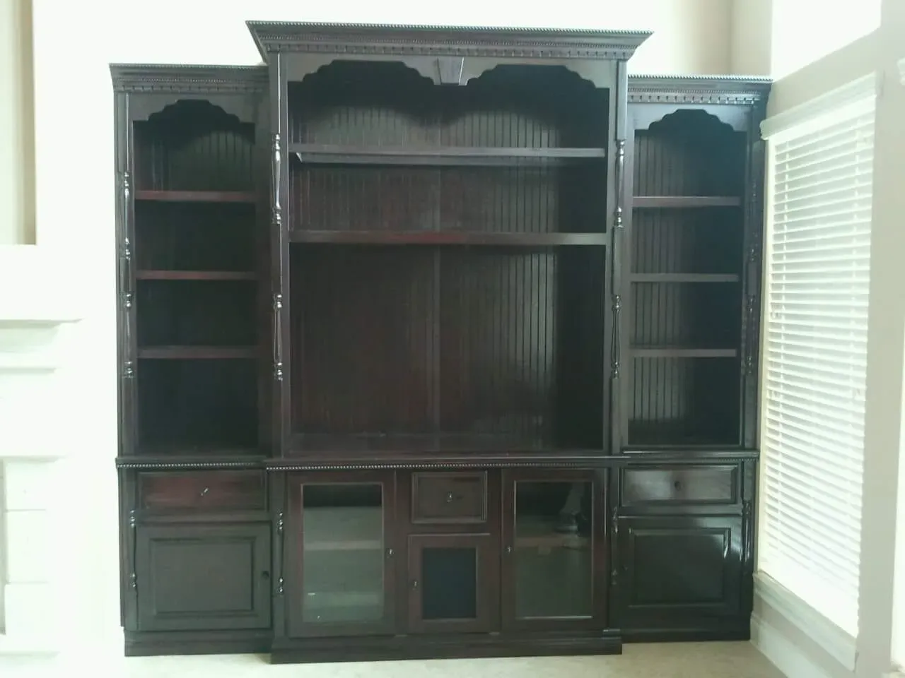 Guest room built-in Murphy bed surround with nightstand shelving on each side