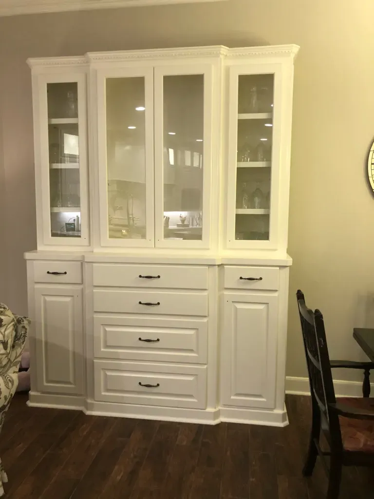 Custom garage storage cabinets with heavy-duty workbench top and upper wall units